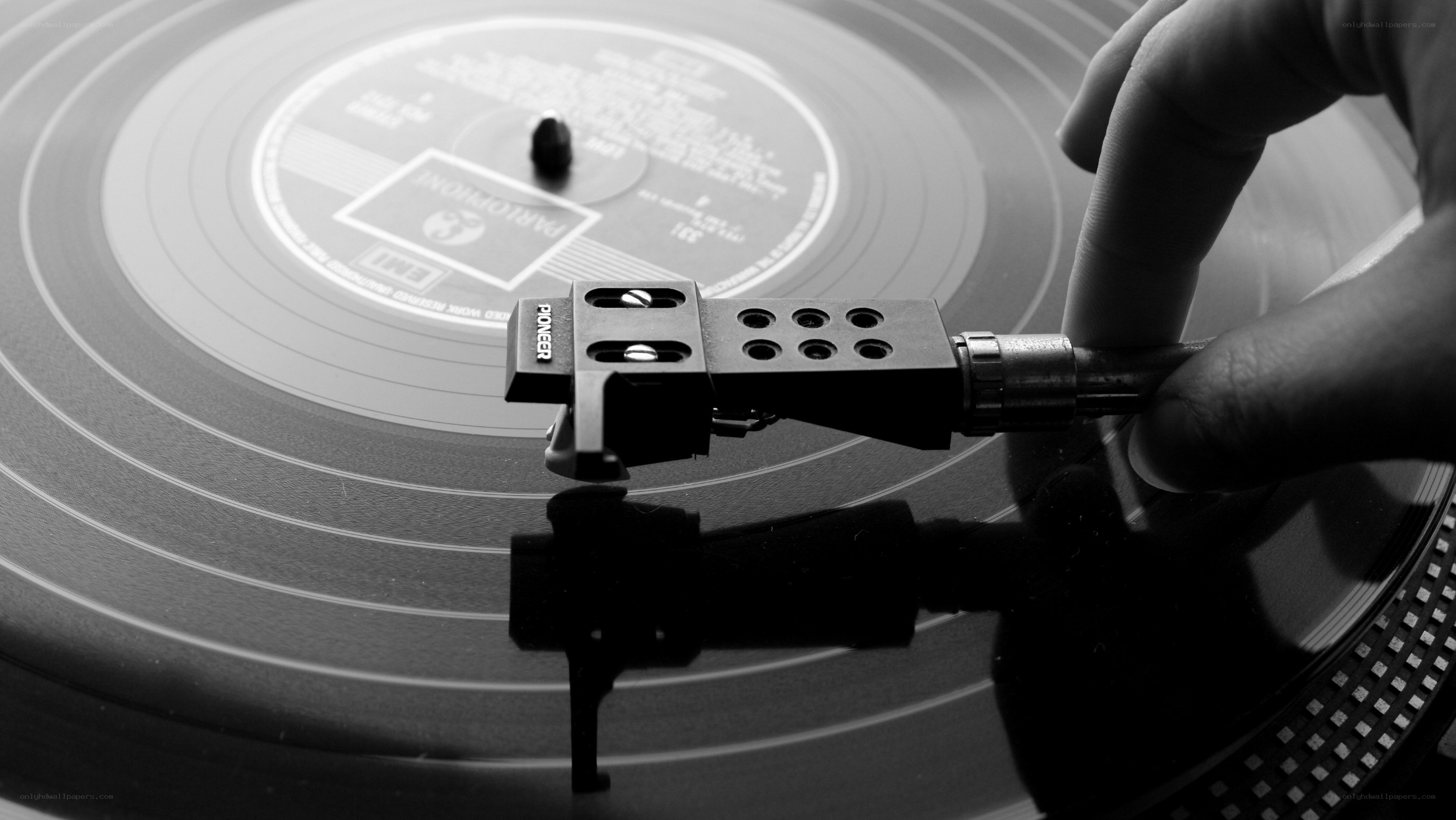 Hand placing turntable needle
