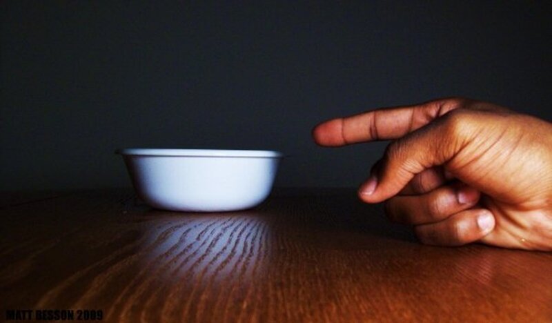 hand pointing at a bowl