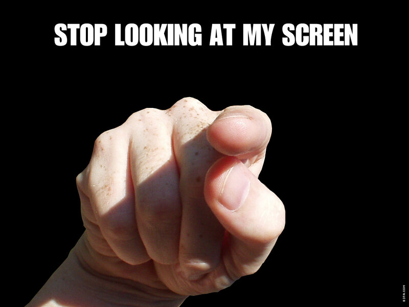 hand pointing at screen