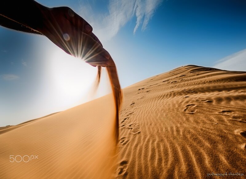 Hand Pouring Sand