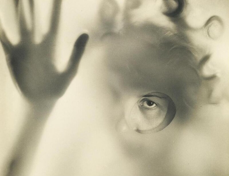 hand pressed against glass