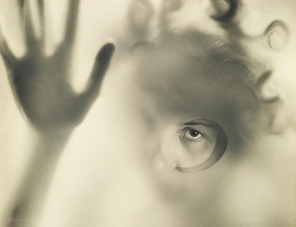hand pressed against glass