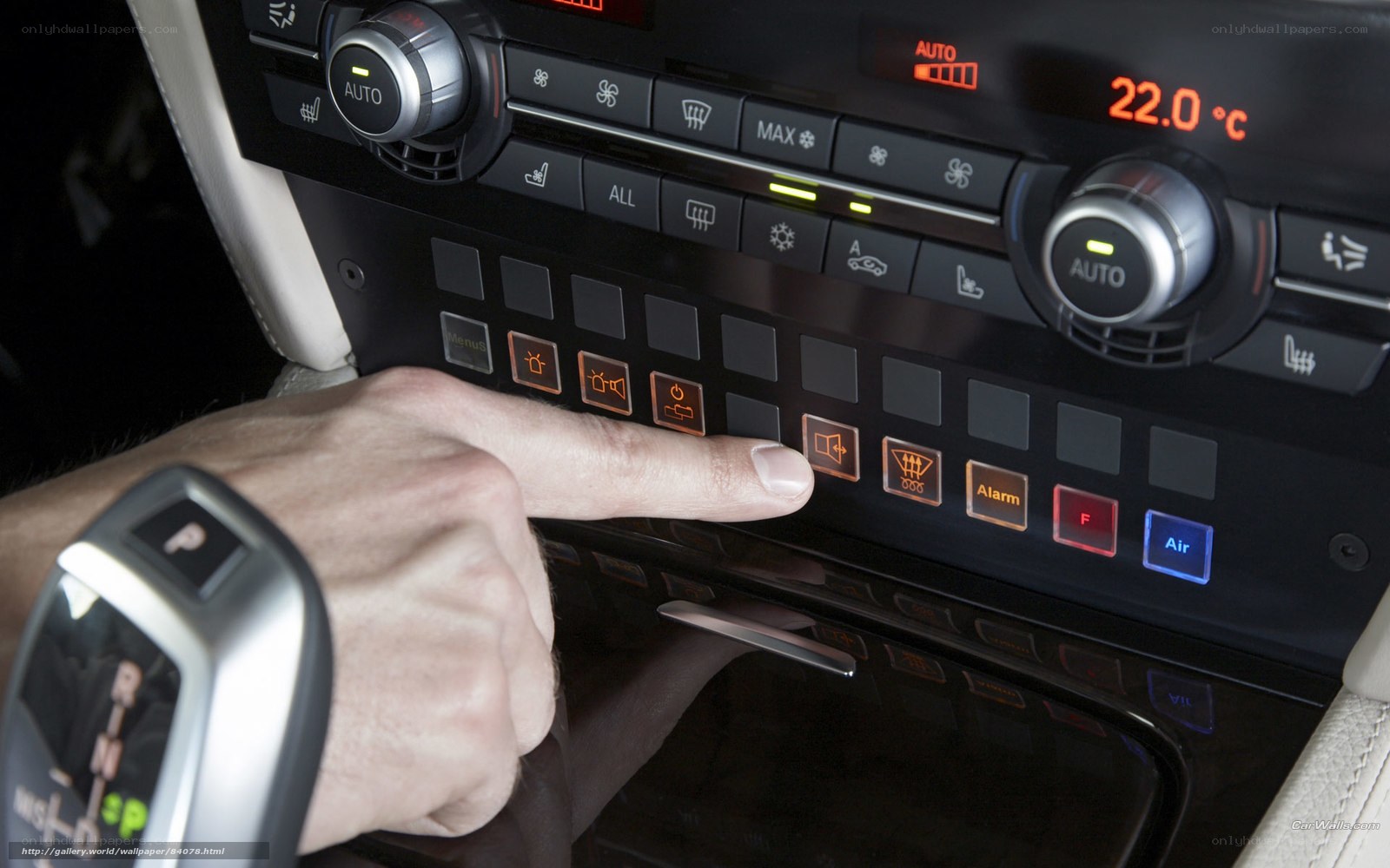 hand pressing car control button