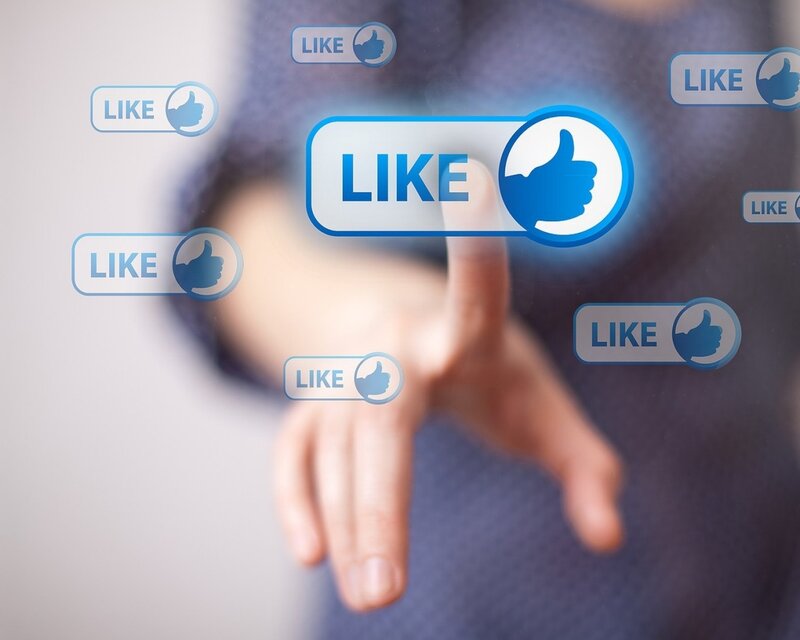 Hand Pressing Like Button — Blue