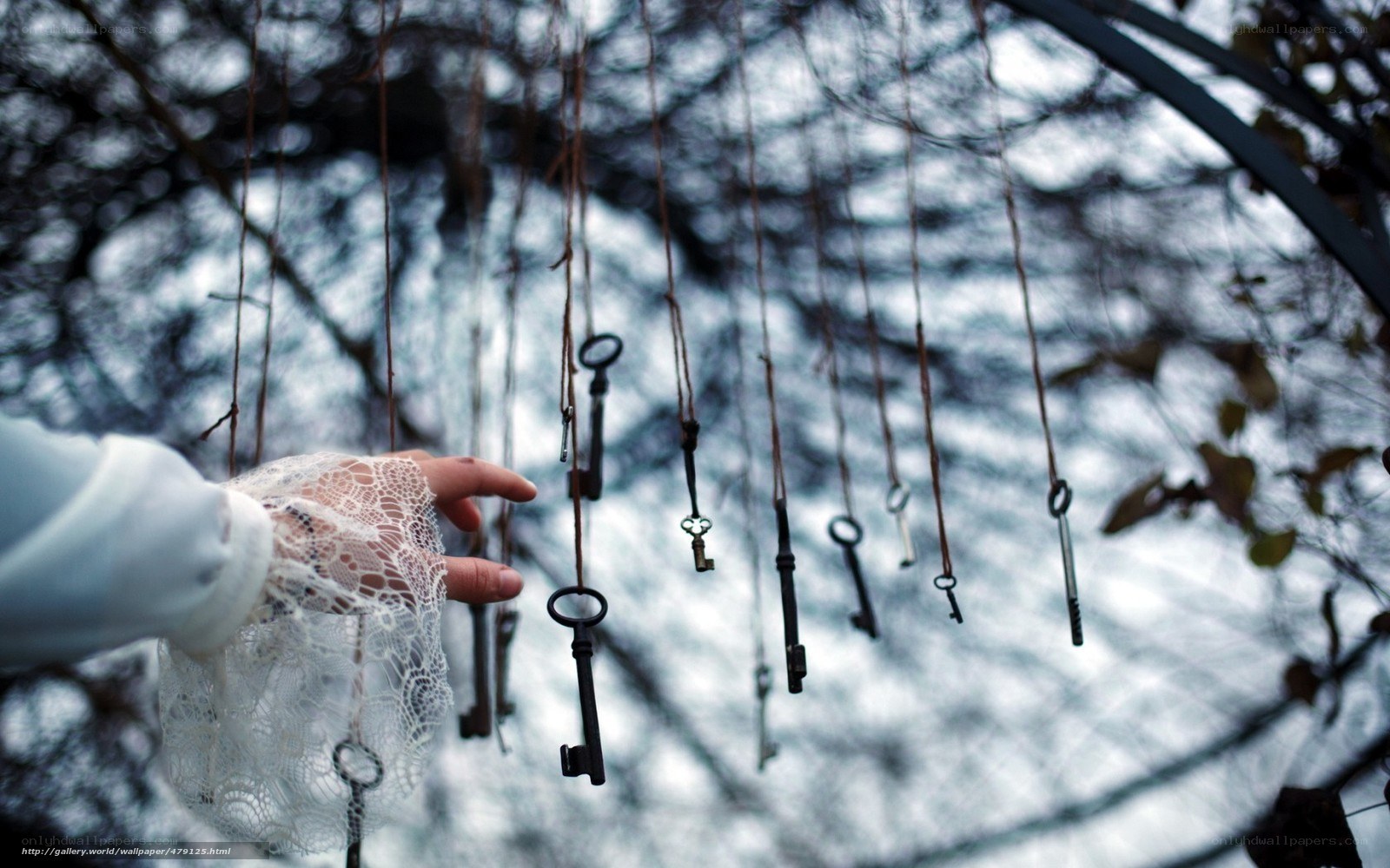 Hand reaching for hanging keys
