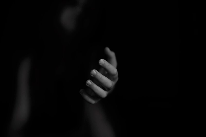 Hand Reaching Forward — Black, Dramatic