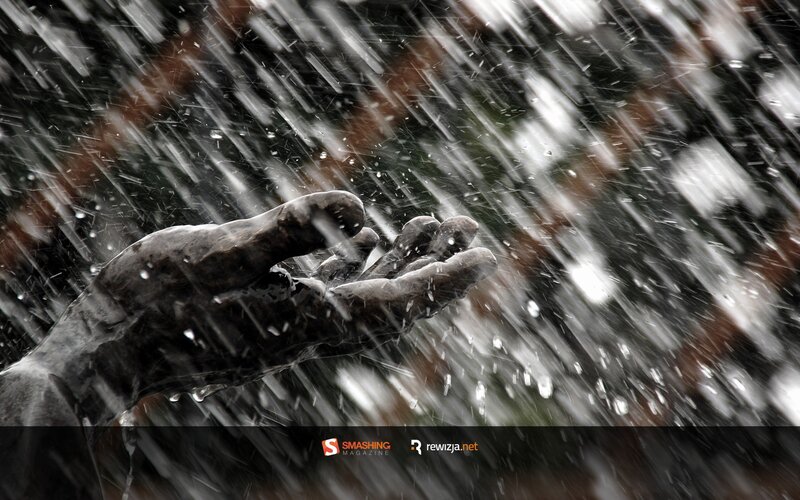 hand reaching in rain