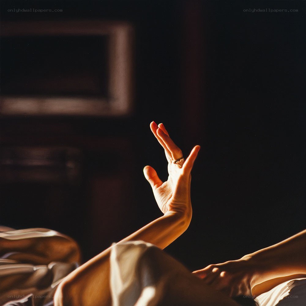 hand reaching in warm light