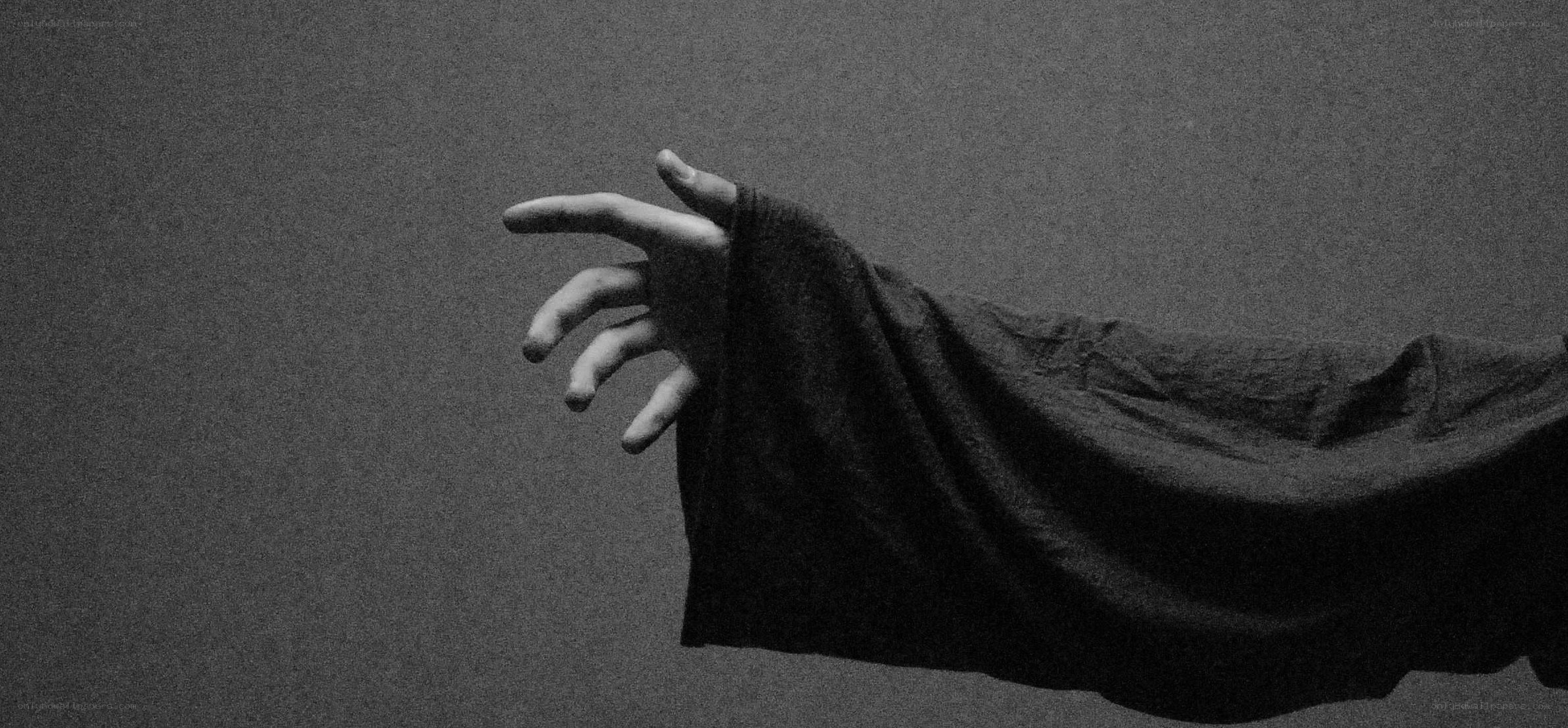 hand reaching out in black and white