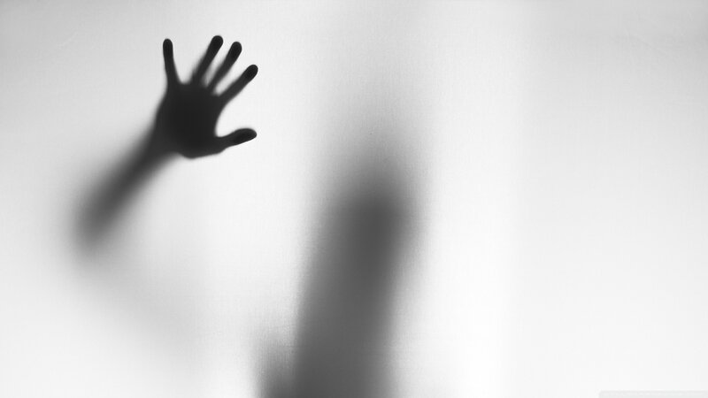 hand shadow on frosted glass