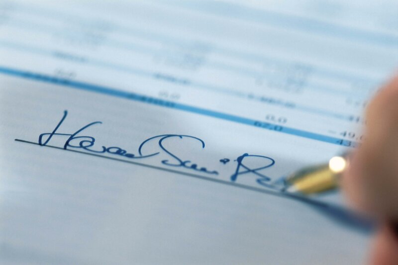 hand signing a document