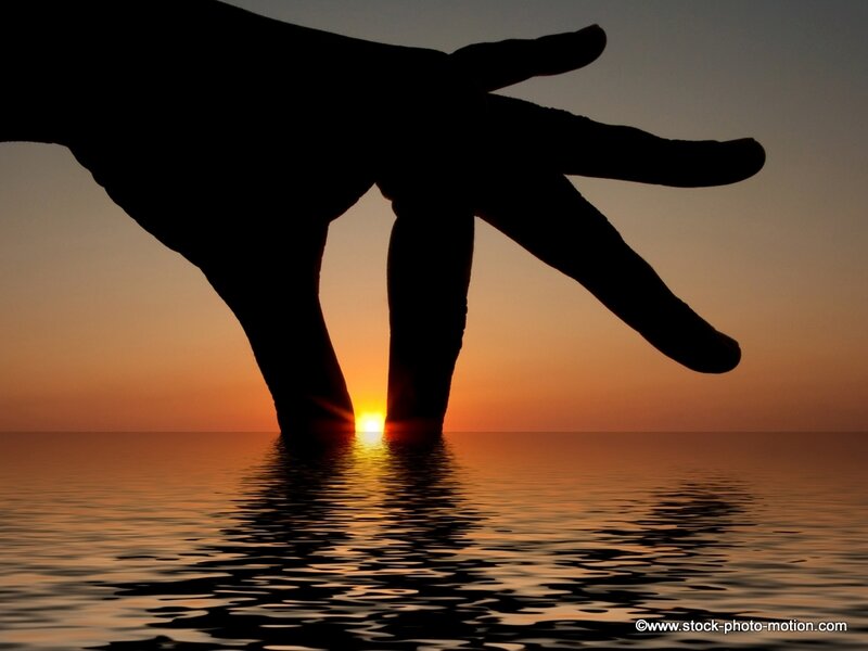 hand silhouette at sunset
