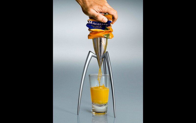 hand squeezing orange juice