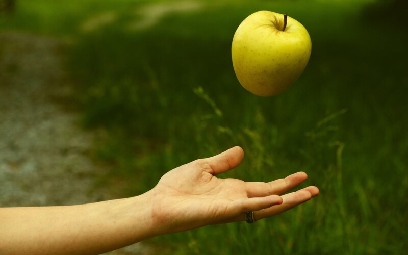 Hand Tossing Apple — Green, Calm