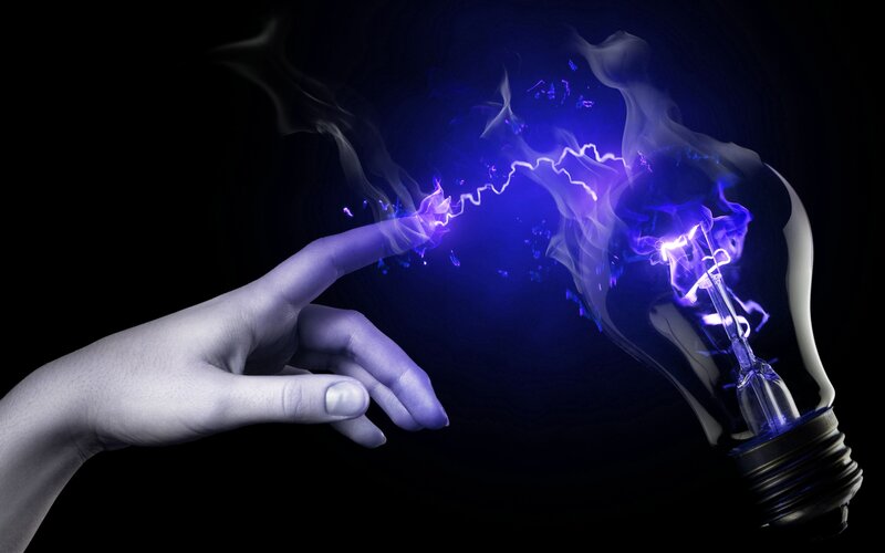 hand touching light bulb