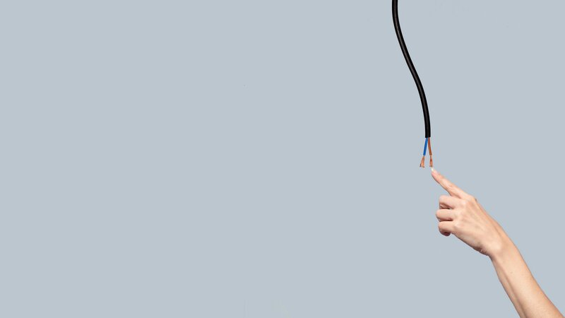 Hand Touching Wire
