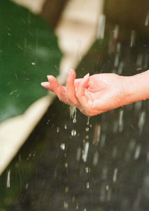 hand under falling water