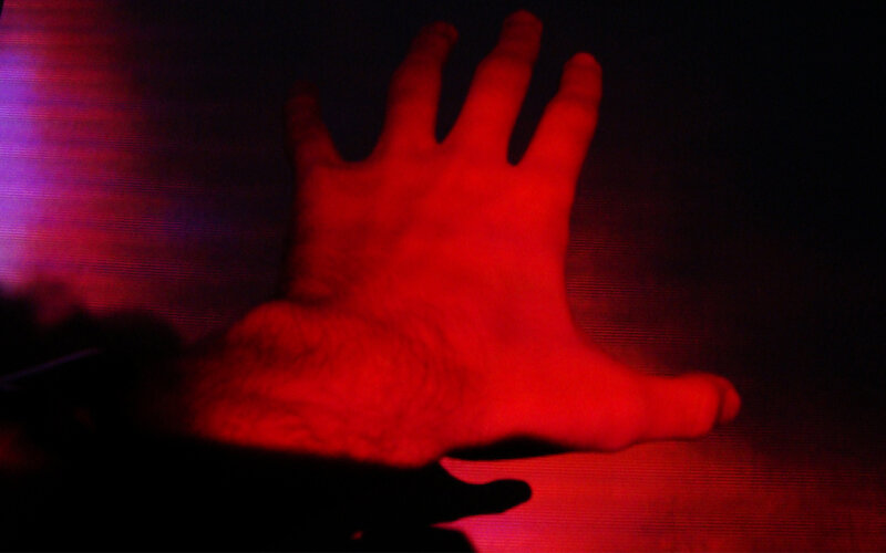 hand under red light