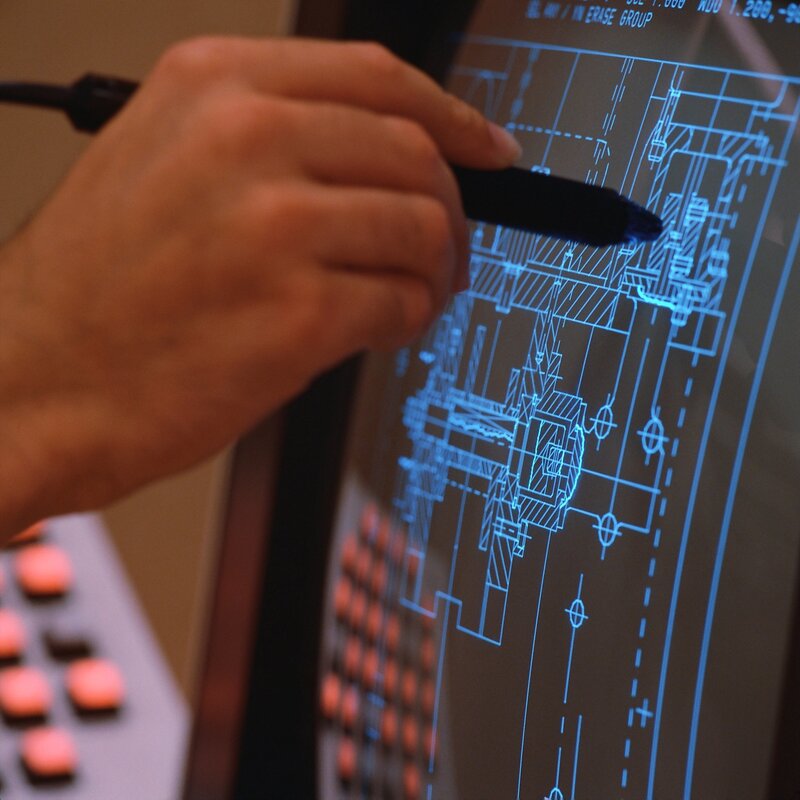 hand using stylus on blueprint screen