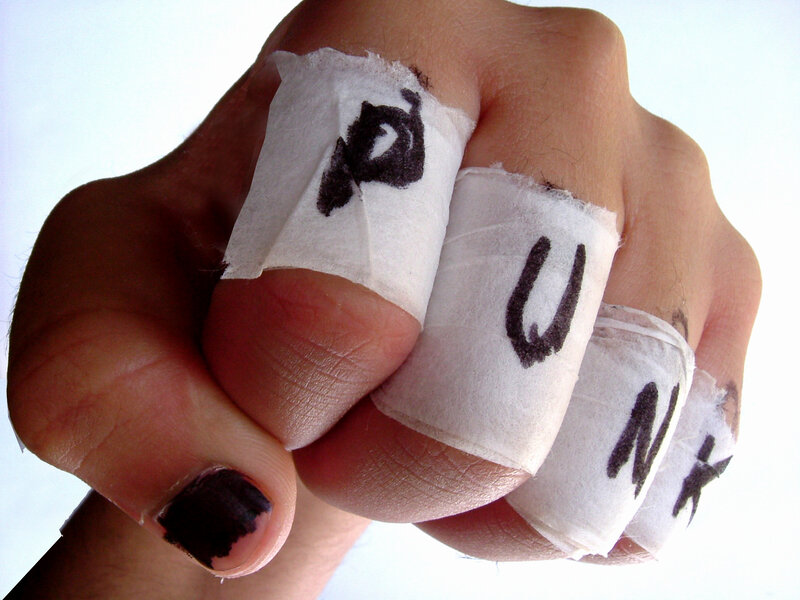 hand with bandages spelling punk