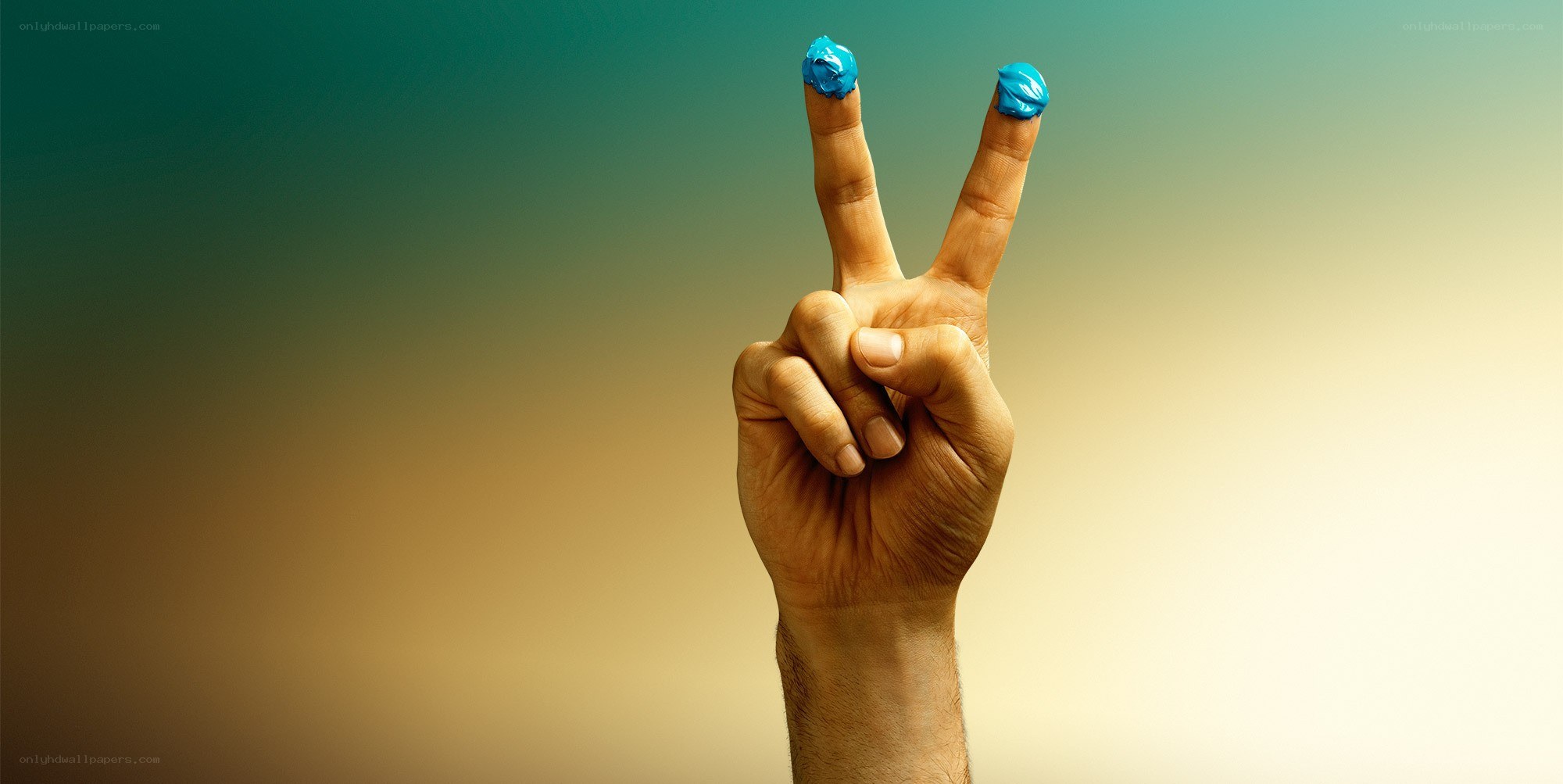 hand with blue ink on fingers