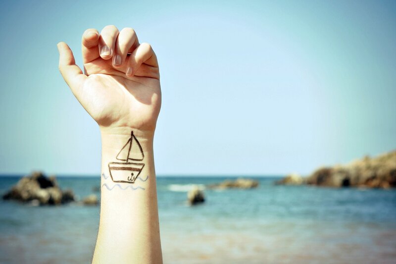 Hand with Boat Drawing