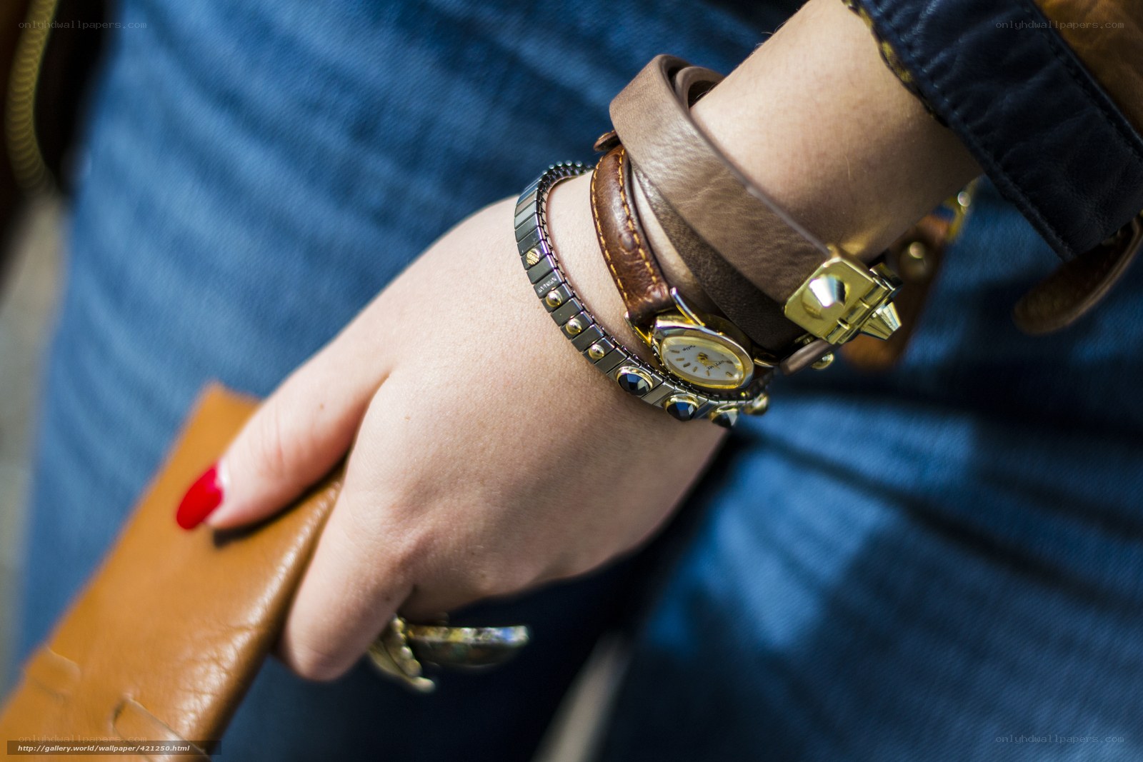 hand with bracelets and watch
