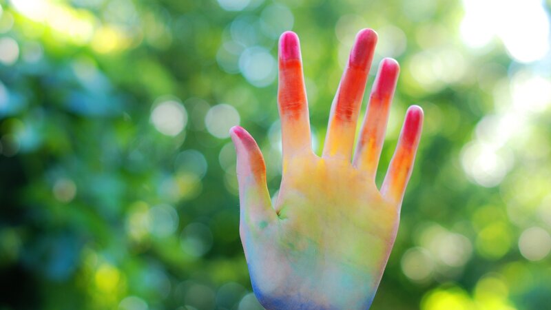 Hand with Colorful Paint — Yellow
