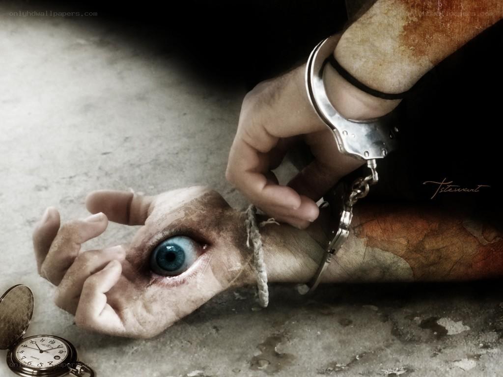 Hand with eye and handcuffs