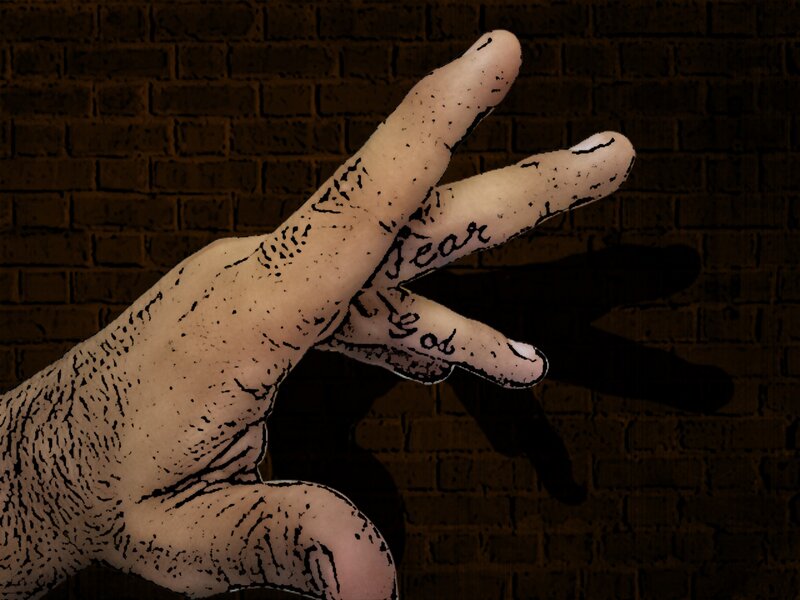 hand with fear of god text