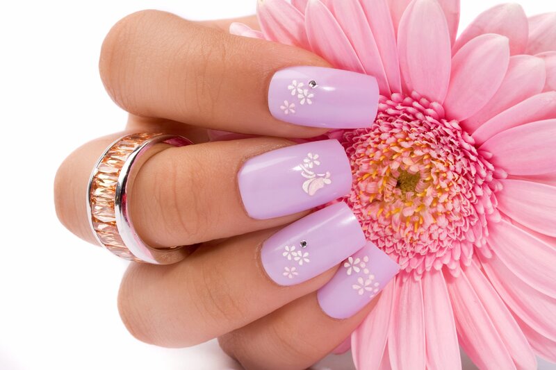 hand with floral nail art
