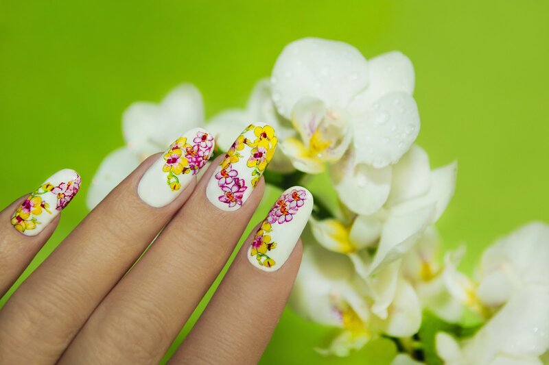 Hand with Floral Nail Art — White