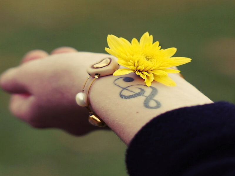 Hand with Flower and Tattoo