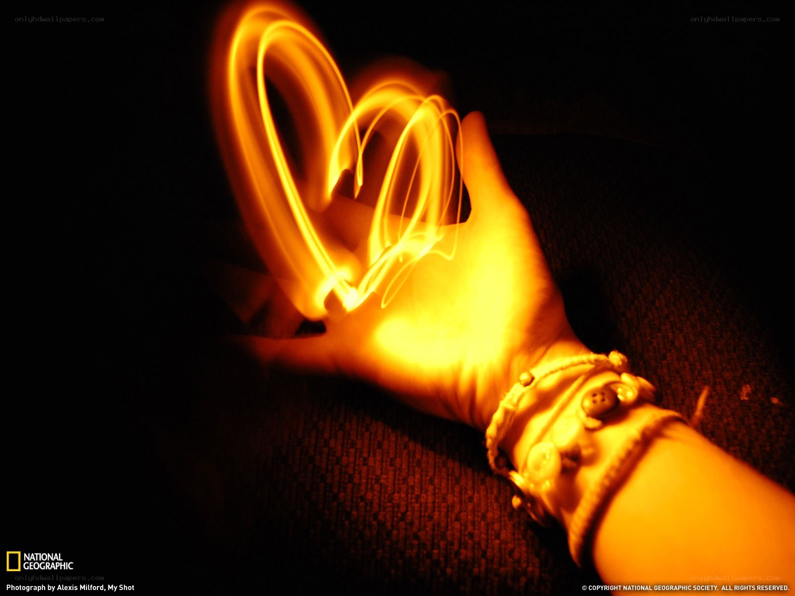 Hand with light painting heart