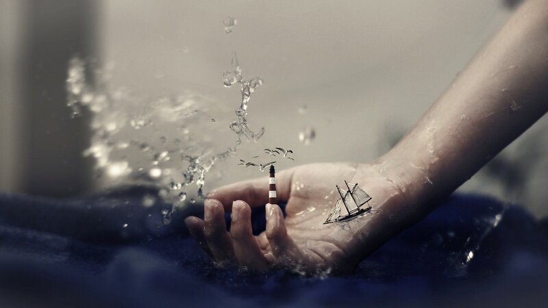 Hand with Miniature Ship — Blue