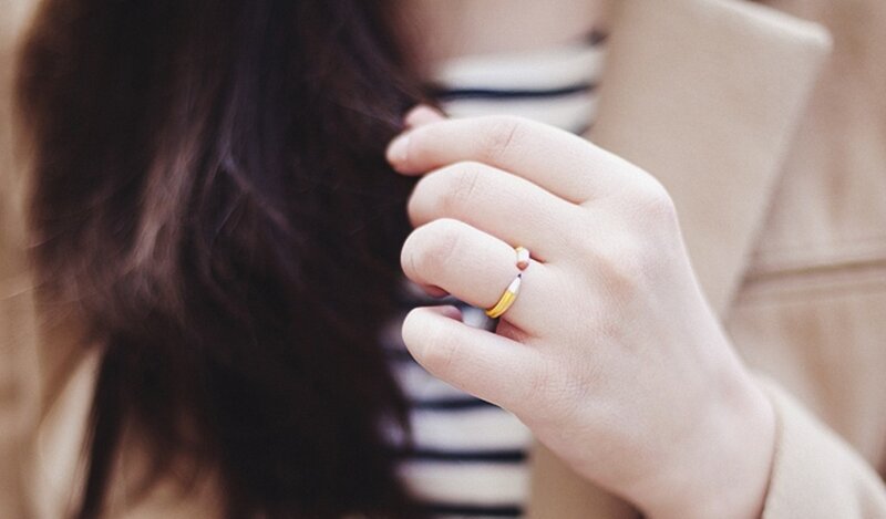 hand with pencil ring