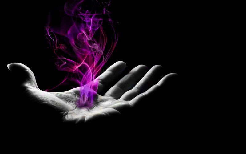 hand with purple smoke