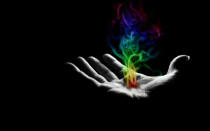 hand with rainbow flame