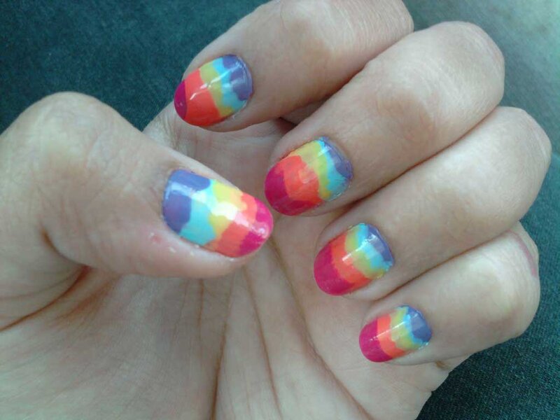 Hand with Rainbow Nails