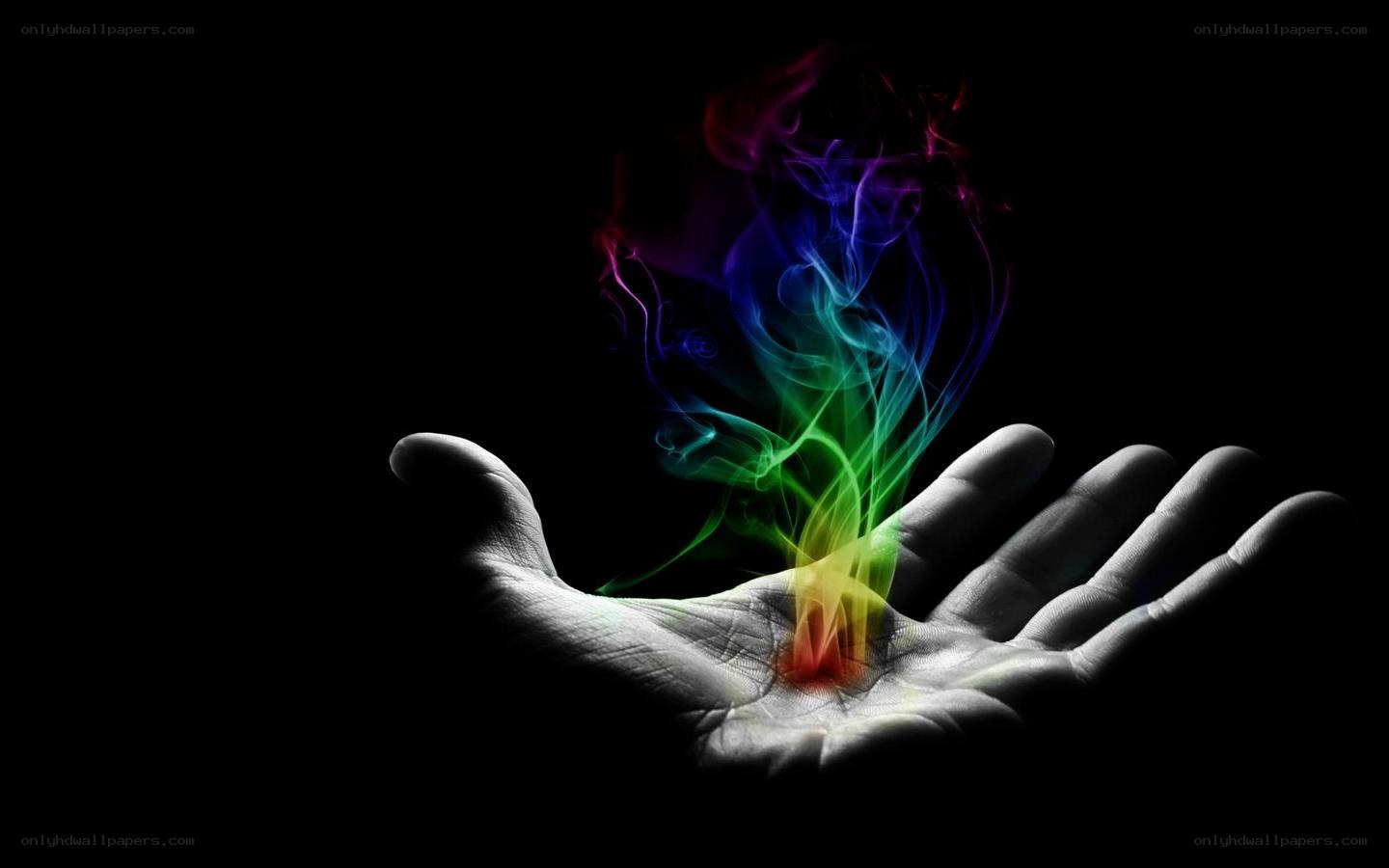 hand with rainbow smoke