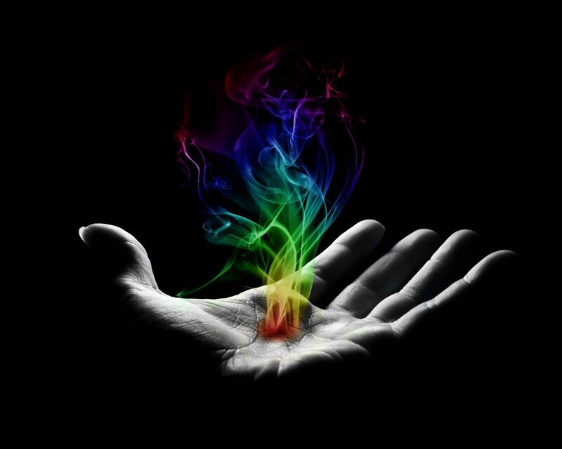 hand with rainbow smoke