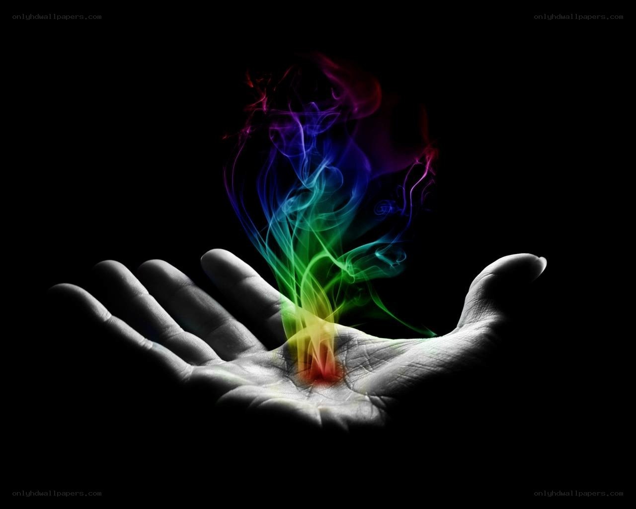 hand with rainbow smoke