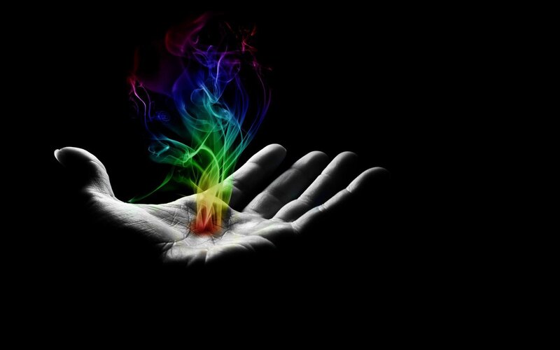 hand with rainbow smoke