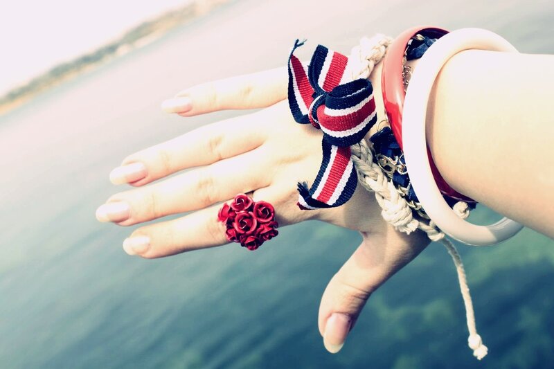 hand with red rose ring