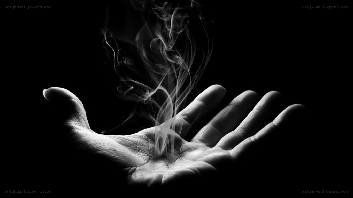 hand with rising smoke