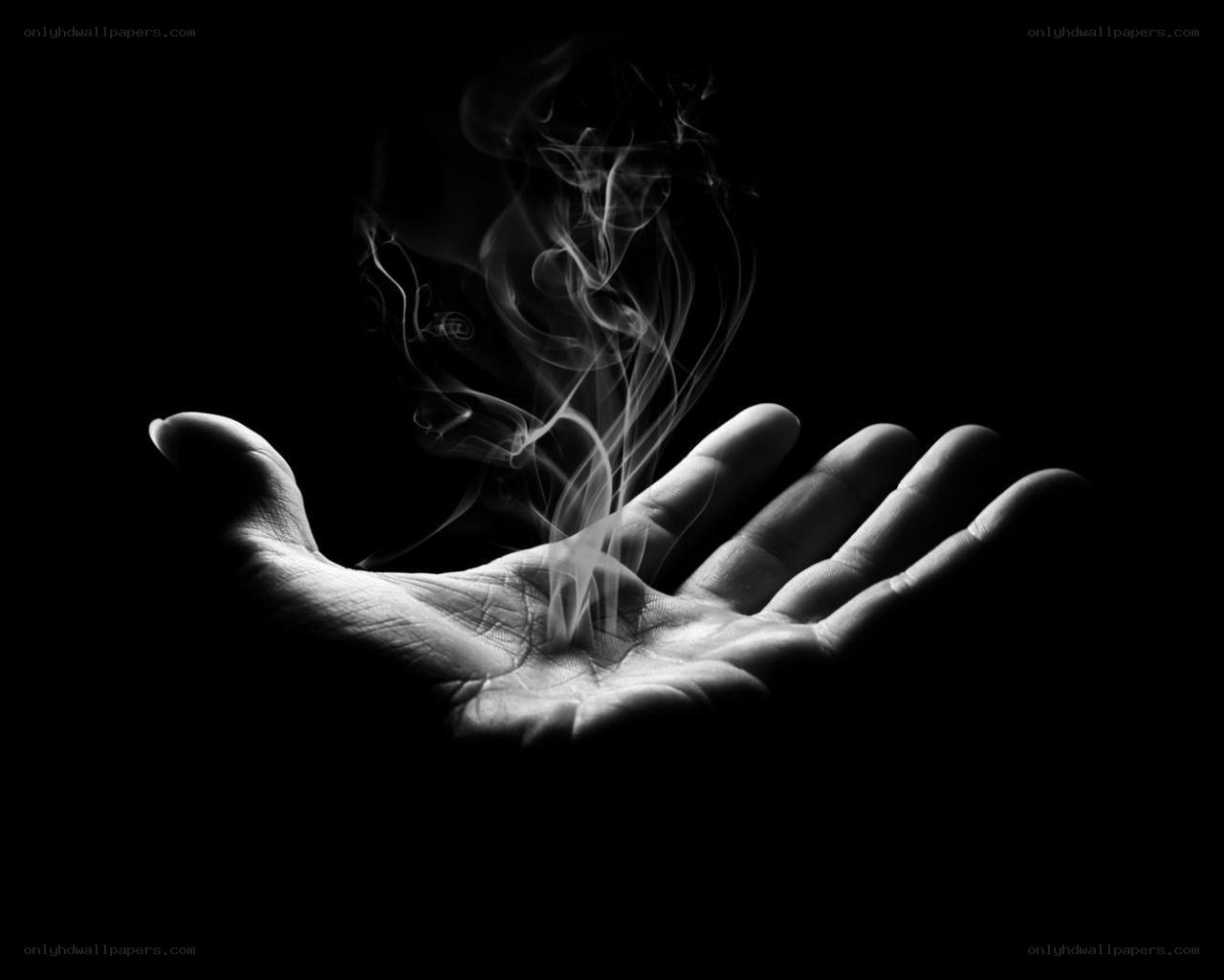 hand with rising smoke