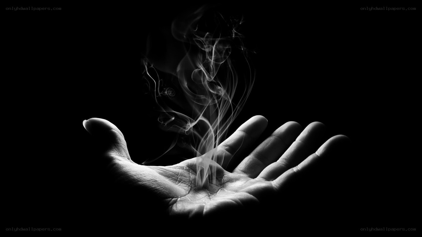 hand with rising smoke