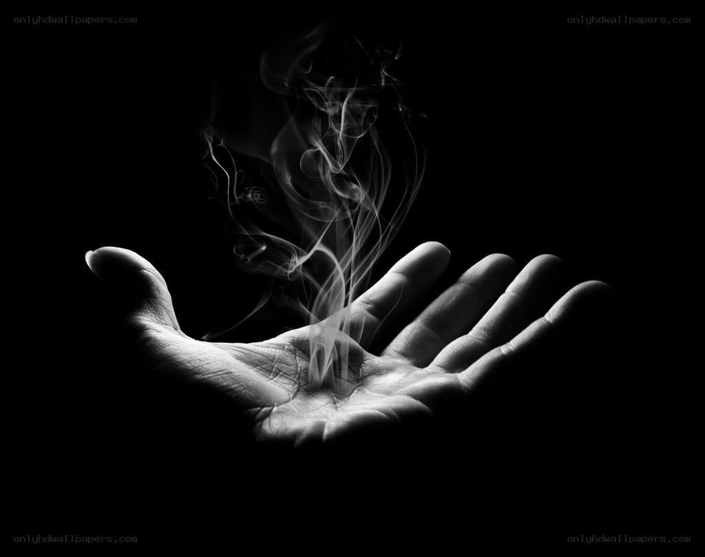 hand with rising smoke
