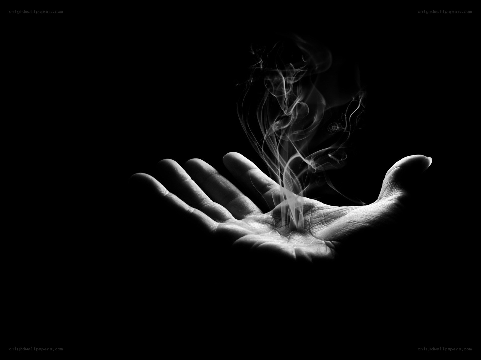 hand with rising smoke