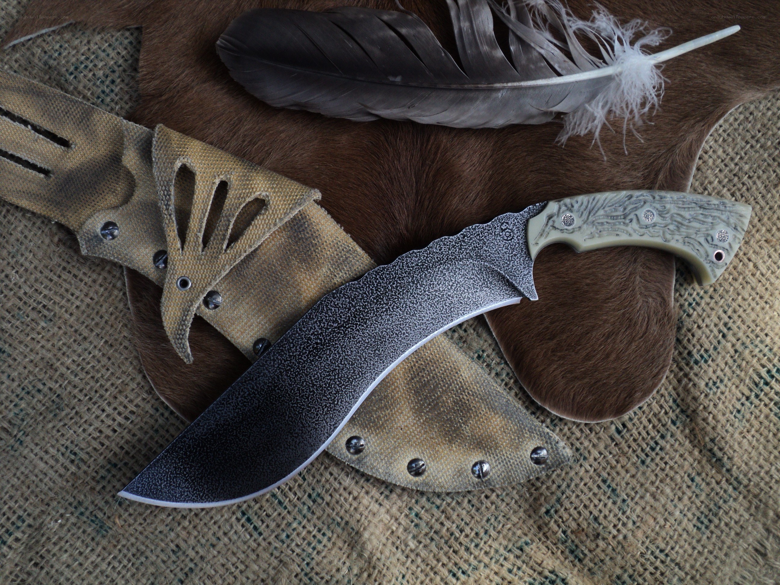 handcrafted knife with feather